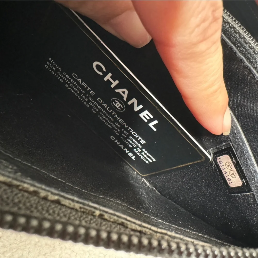 Authentic  Chanel Camelia patent leather zip around‎ wallet long